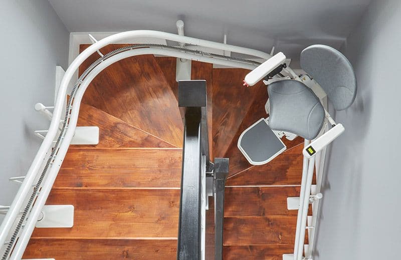 Stairlift specifically designed for curved staircases, ensuring smooth and safe transportation along the unique path of curved stairs.